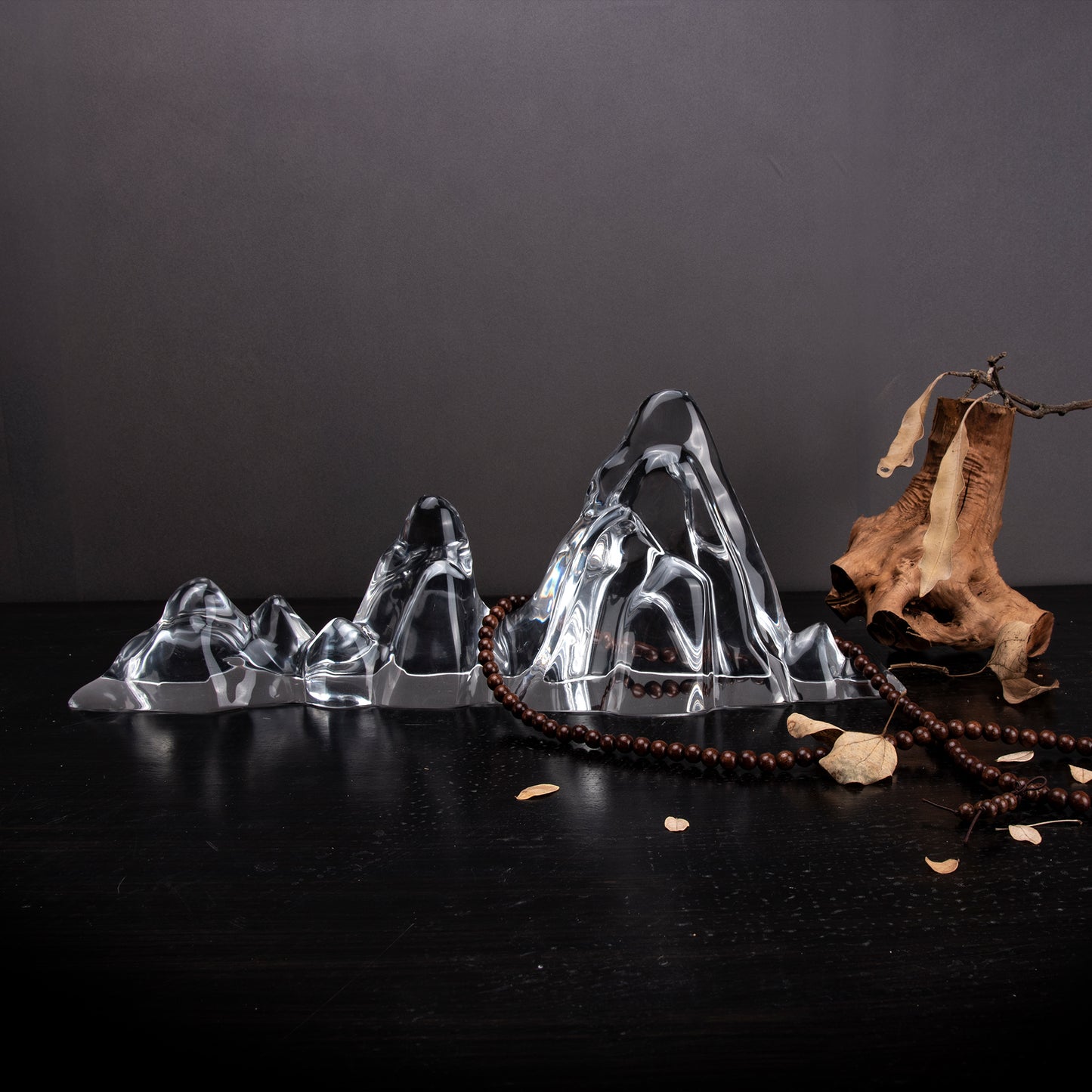 Chinese sculpture with a mountain design form and clear body, styled with a wood piece for upscale home furnishings. Natural art sculpture used for home decoration.