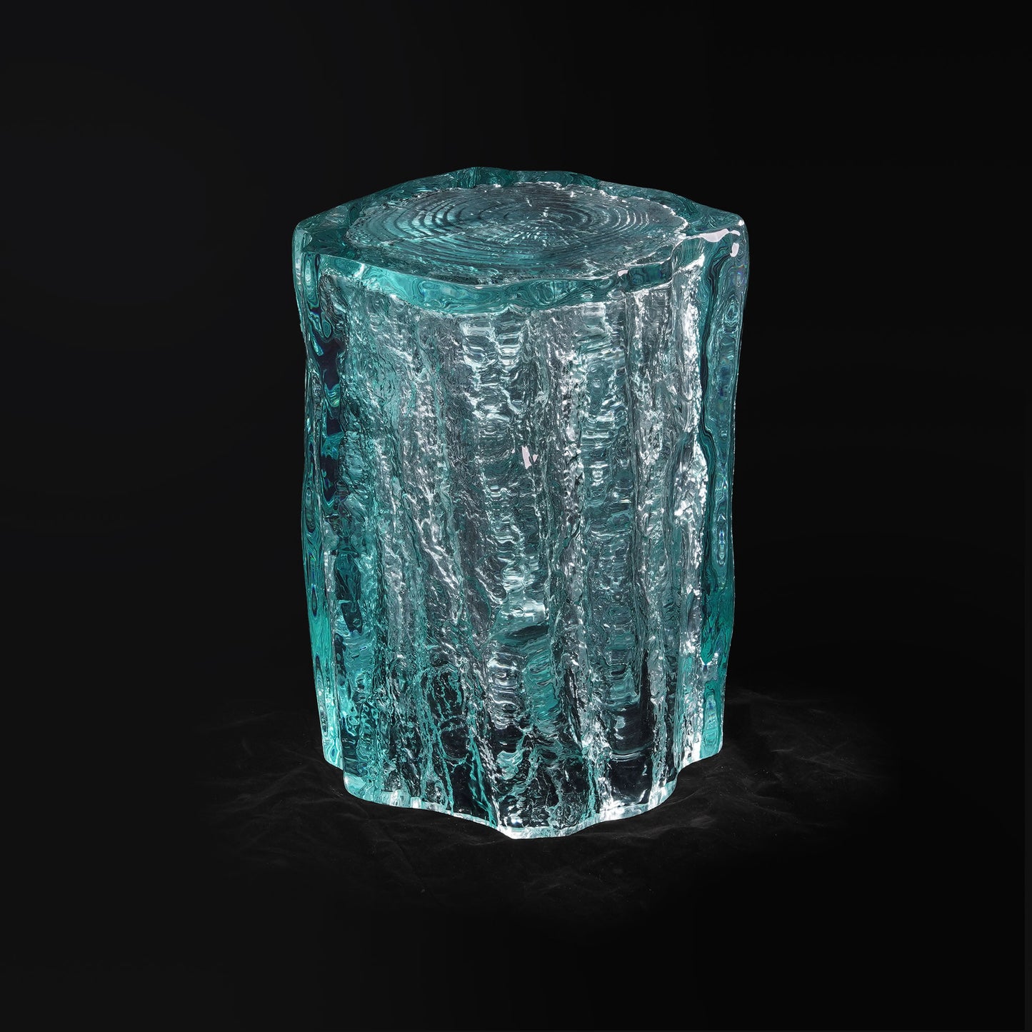 Art deco side table featuring ice-carving texture inside blue clear irregular shape. Blue tables used for entryway or living room decoration.