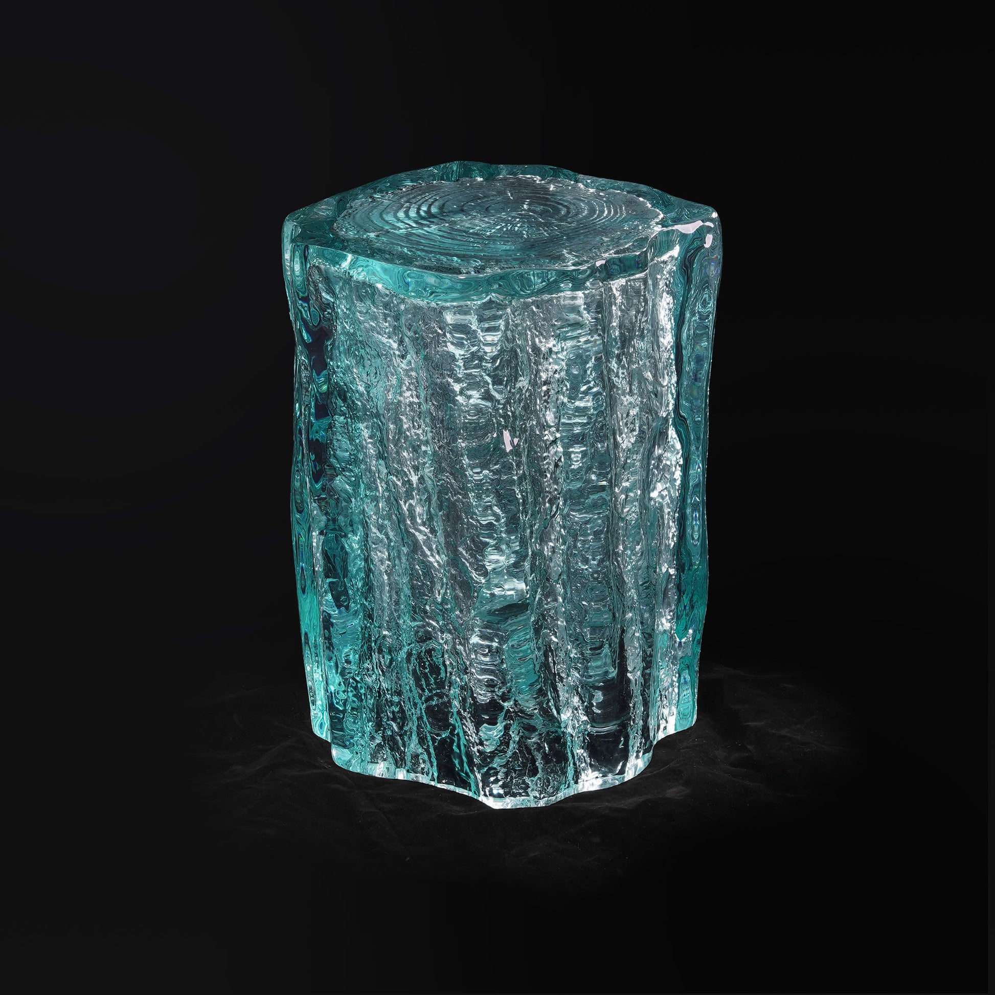 Art deco side table featuring ice-carving texture inside blue clear irregular shape. Blue tables used for entryway or living room decoration.