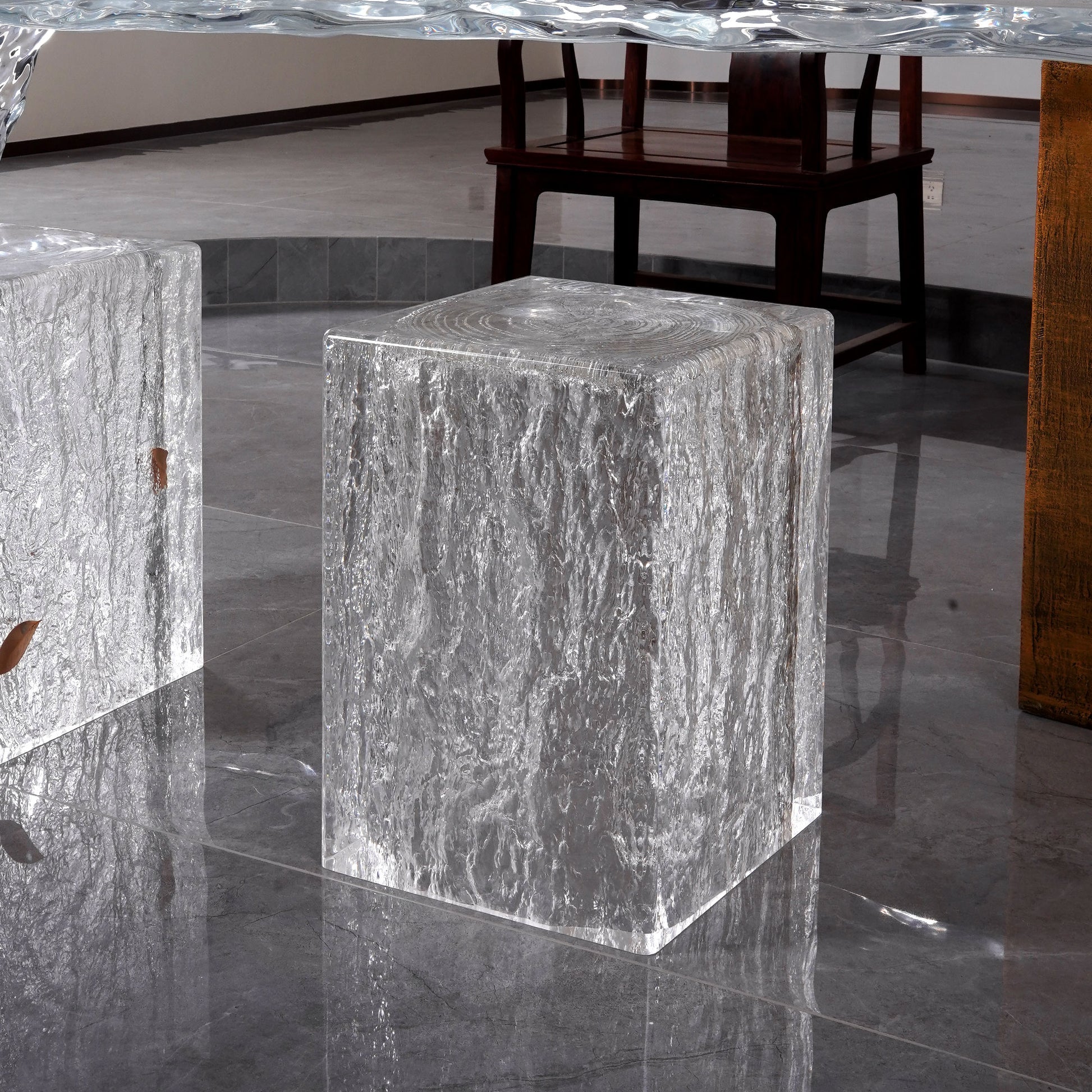 Upscale home furniture used as minimalist bedside table or side stools for living room placed beside wooden furniture in a modern interior setting. An ottoman stool seat used for modern home furnishing.